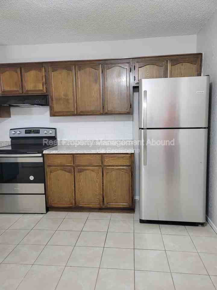 8006 N 117th East Ave - Photo 3 of 20
