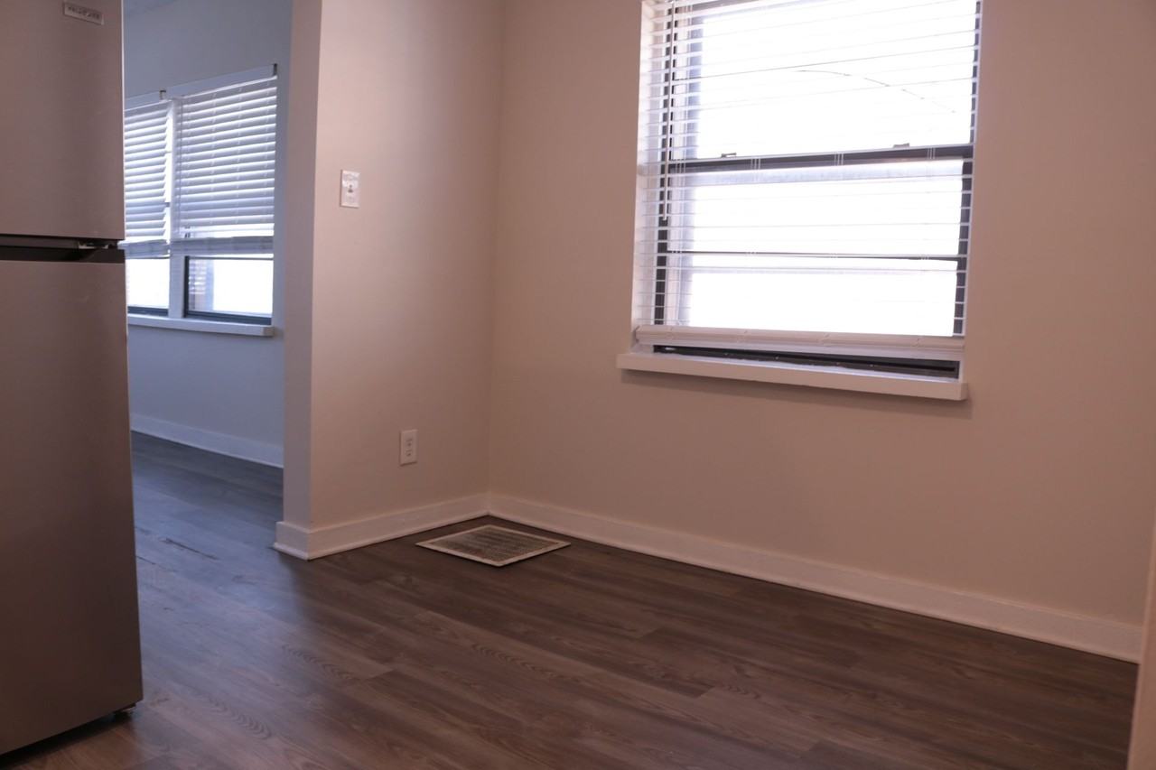 Charming & Updated | Spacious Layouts Near KCAI & UMKC in historic Hyde Park - Photo 6 of 15