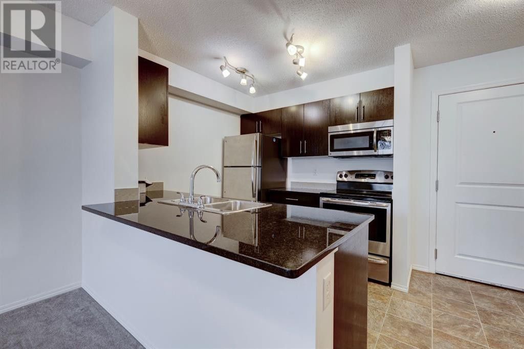 7210 - 403 Mackenzie Way Southwest - Photo 4 of 26