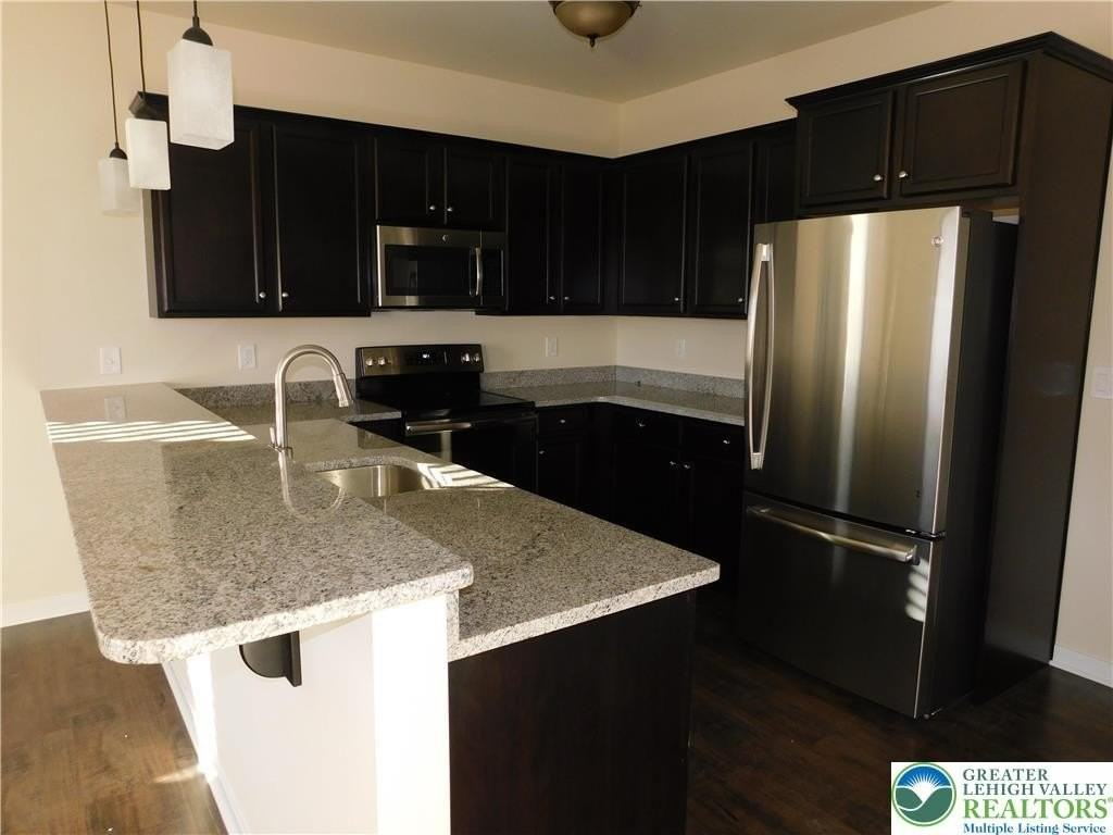 25 John Aly - Photo 5 of 15