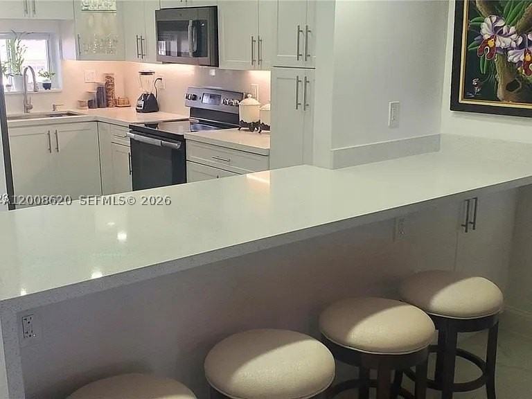9720 S Hollybrook Lake Dr #303 - Photo 2 of 11