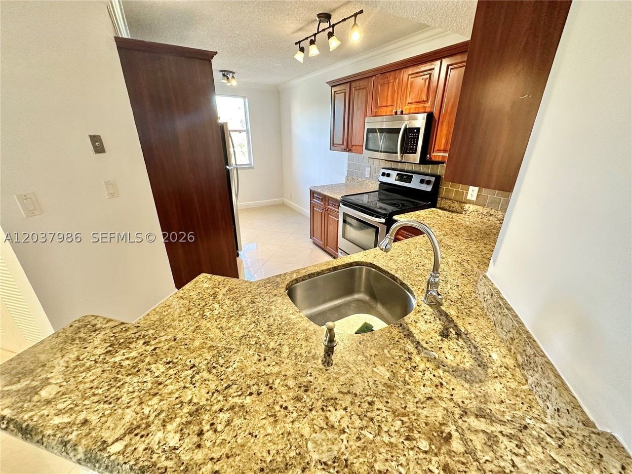 8955 Wiles Rd #208 - Photo 4 of 29