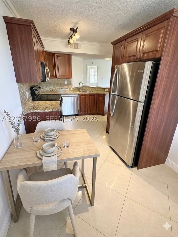 8955 Wiles Rd #208 - Photo 5 of 29
