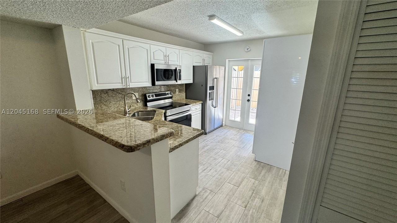 7439 W 22nd Ave #103 - Photo 3 of 13