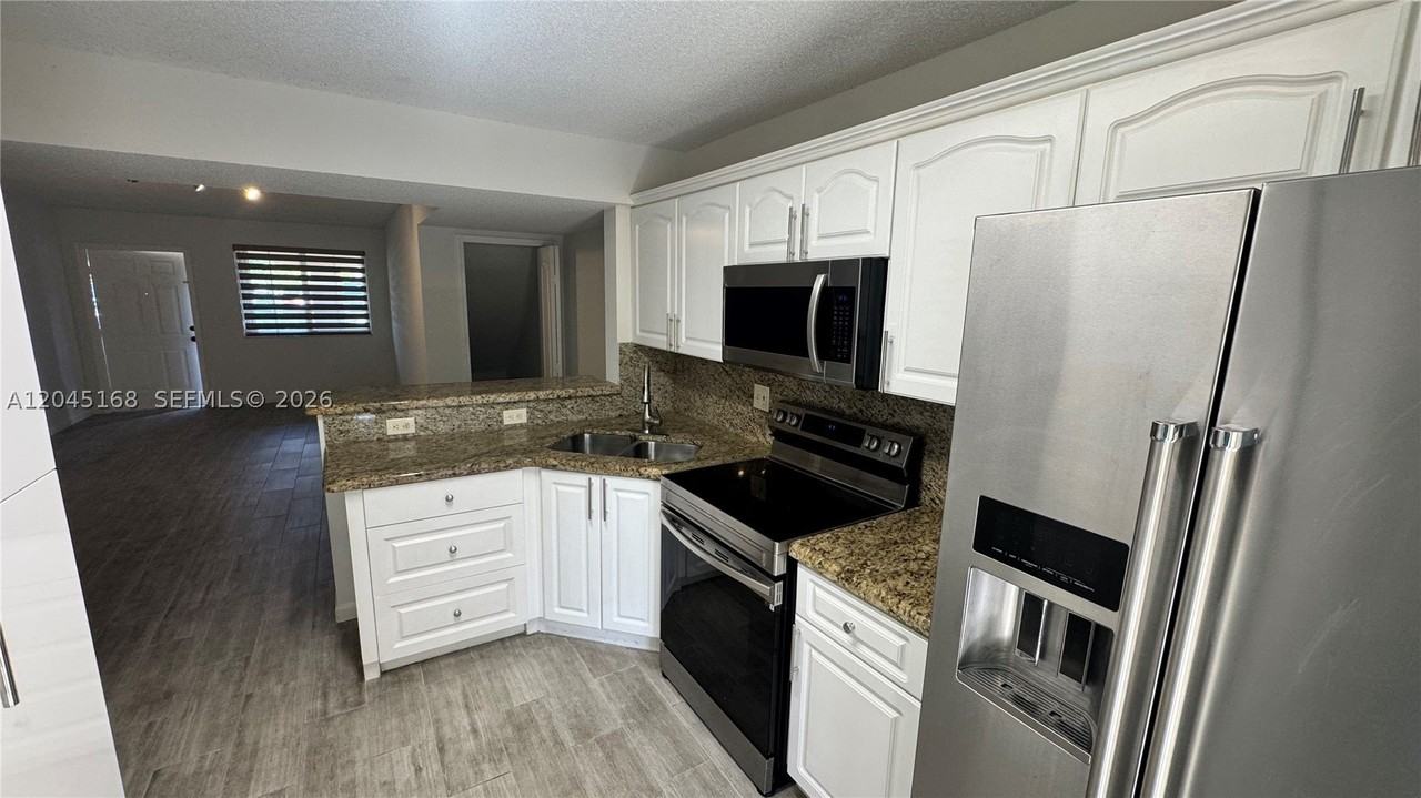 7439 W 22nd Ave #103 - Photo 4 of 13