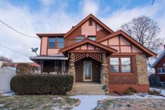 Beautifully updated Tudor style duplex. Upper unit. Large rooms. 2 balconies, private entry. Fenced in Yard with Garage. - Photo 1 of 1