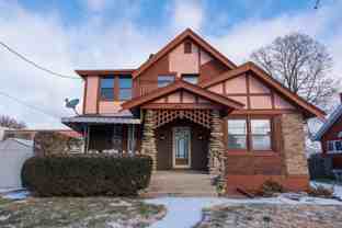 Beautifully updated Tudor style duplex. Upper unit. Large rooms. 2 balconies, private entry. Fenced in Yard with Garage. - Photo 1 of 1