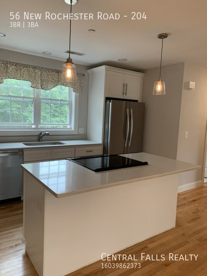 56 New Rochester Rd #204 - Photo 2 of 11