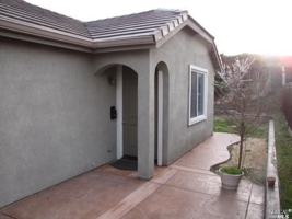 featured image of Studio 868 Antiquity Drive behind 2 car garage