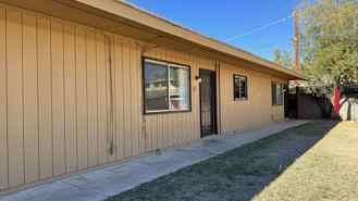 Central (Grant and  Dodge) single story apartment complex, a/cs, private fenced yards and laundry on site! - Photo 1 of 1