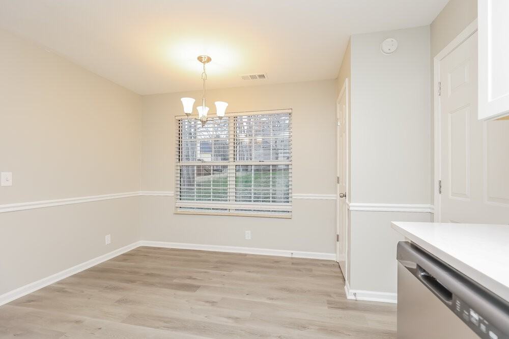 1409 Woodchimes Ct - Photo 6 of 17