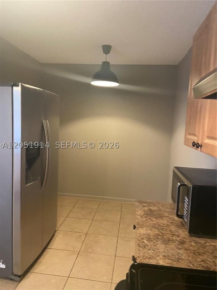 8871 Wiles Rd #301 - Photo 6 of 12