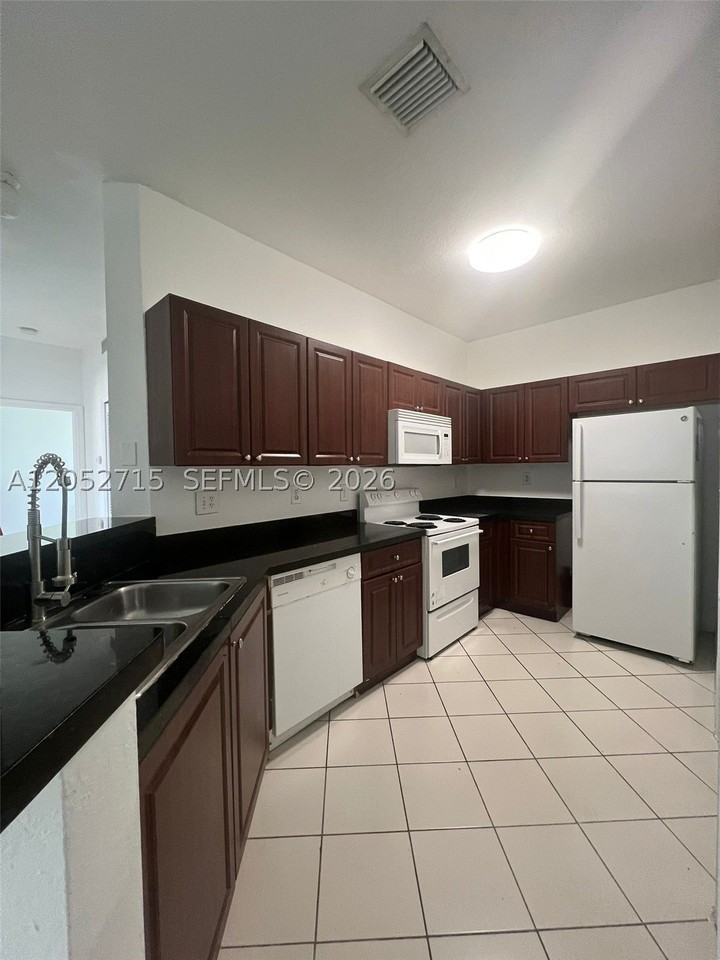 7200 Nw 177th St #206-7 - Photo 2 of 10