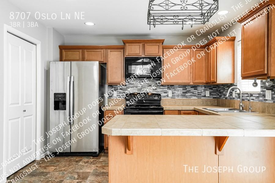 8707 Oslo Ln Ne - Photo 7 of 23