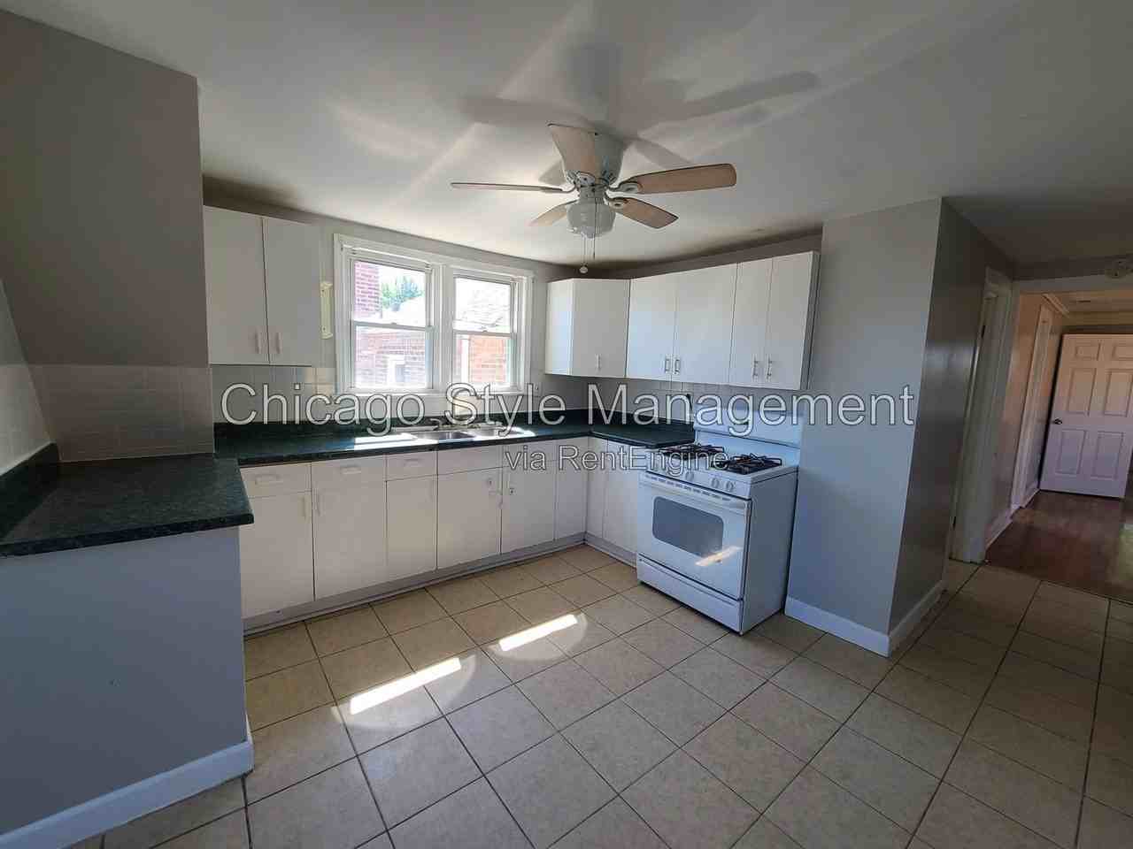 6035 S Karlov Ave #2ndFL - Photo 2 of 19