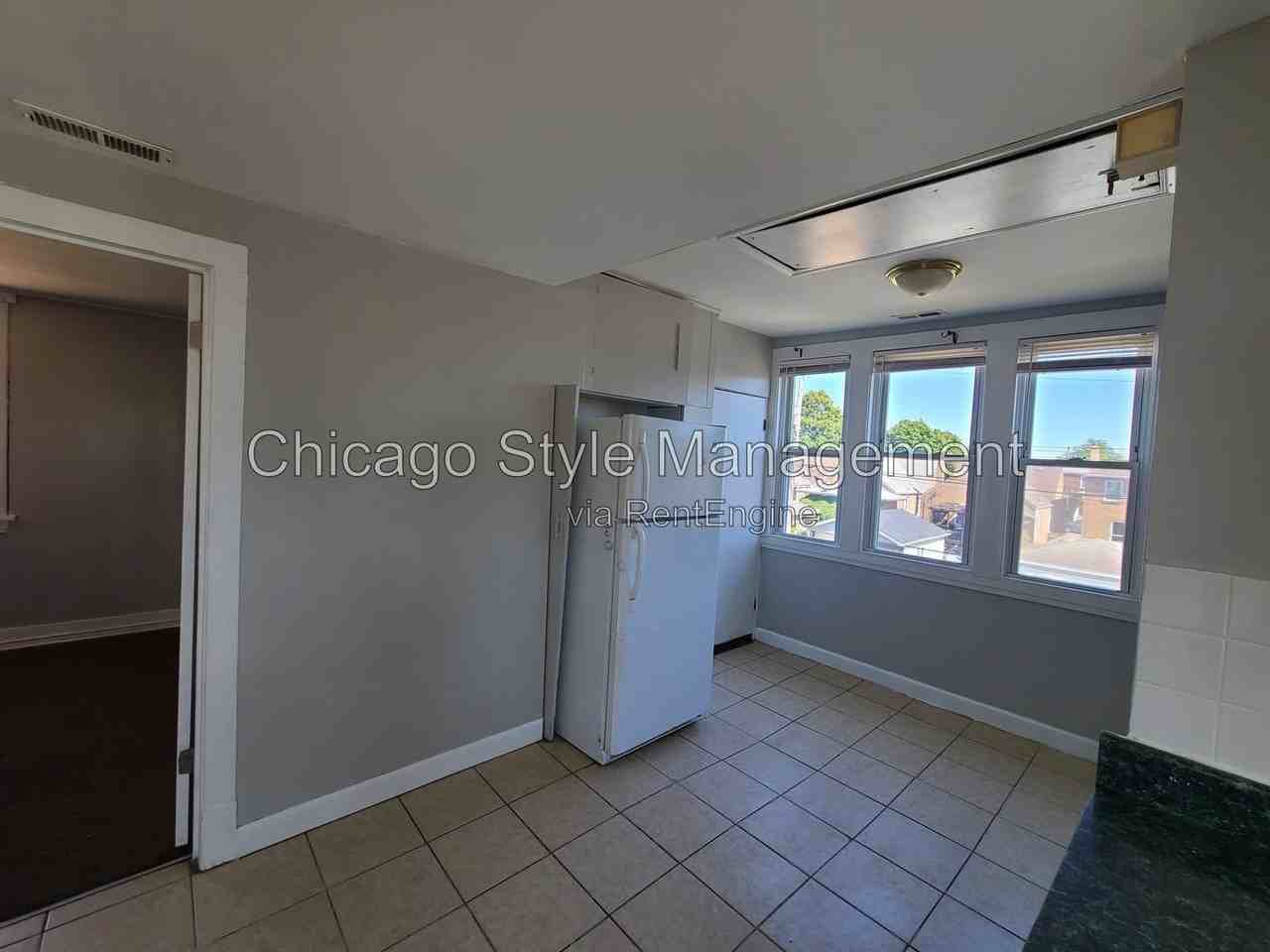 6035 S Karlov Ave #2ndFL - Photo 4 of 19
