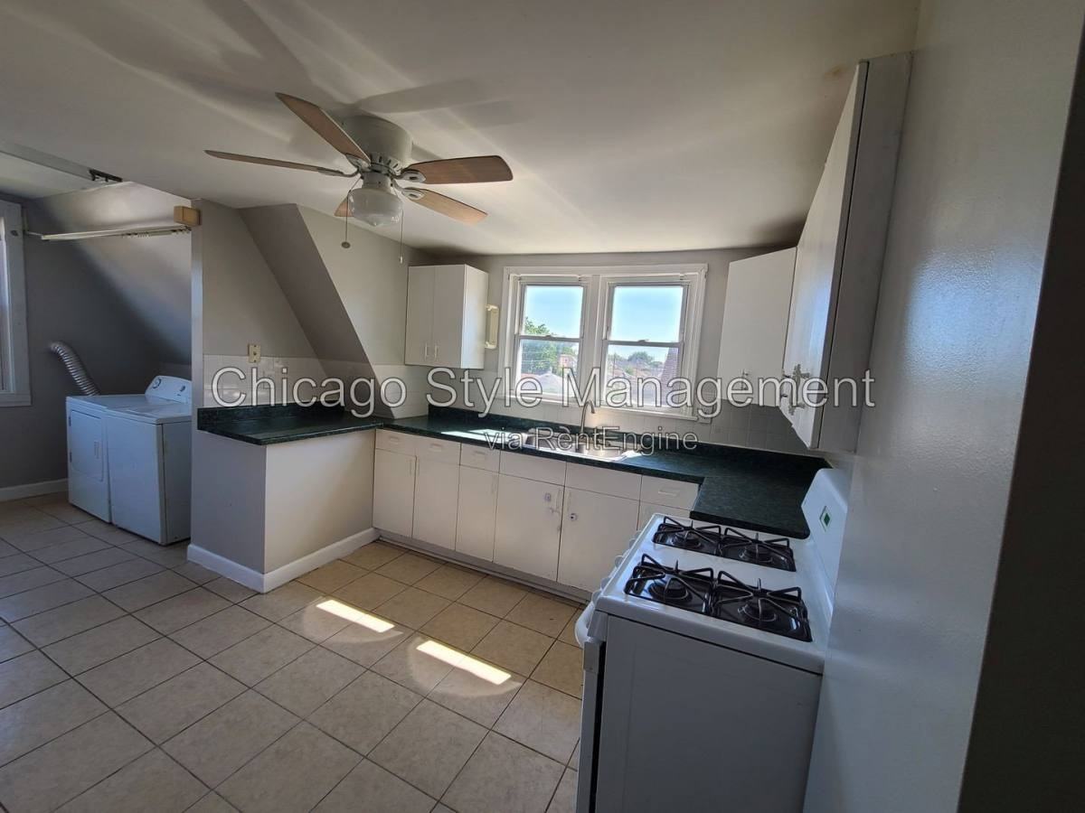 6035 S Karlov Ave Apt 2nd - Photo 3 of 10