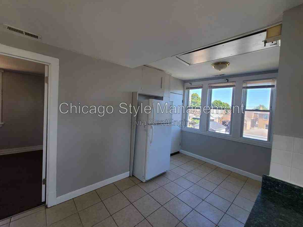 6035 S Karlov Ave Apt 2nd - Photo 4 of 10