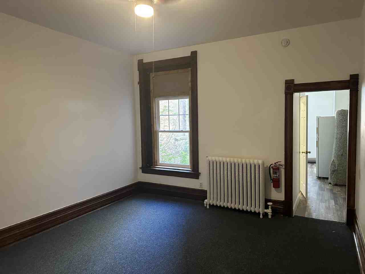 115 E 3rd St - Photo 2 of 8