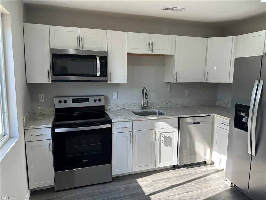 1265 W 40th St - Photo 6 of 23