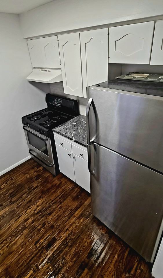 6113 S Troost Ave - Photo 5 of 6