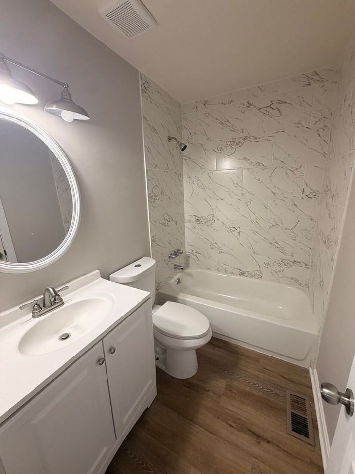 5015 Wellsworth Ave - Photo 6 of 16
