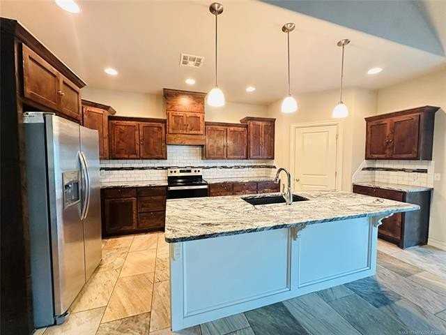 8111 N 75th East Ave - Photo 7 of 50