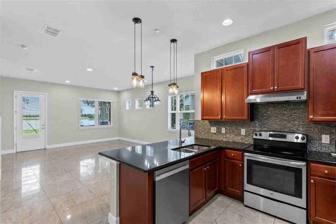 13775 Benavente Ave - Photo 6 of 34