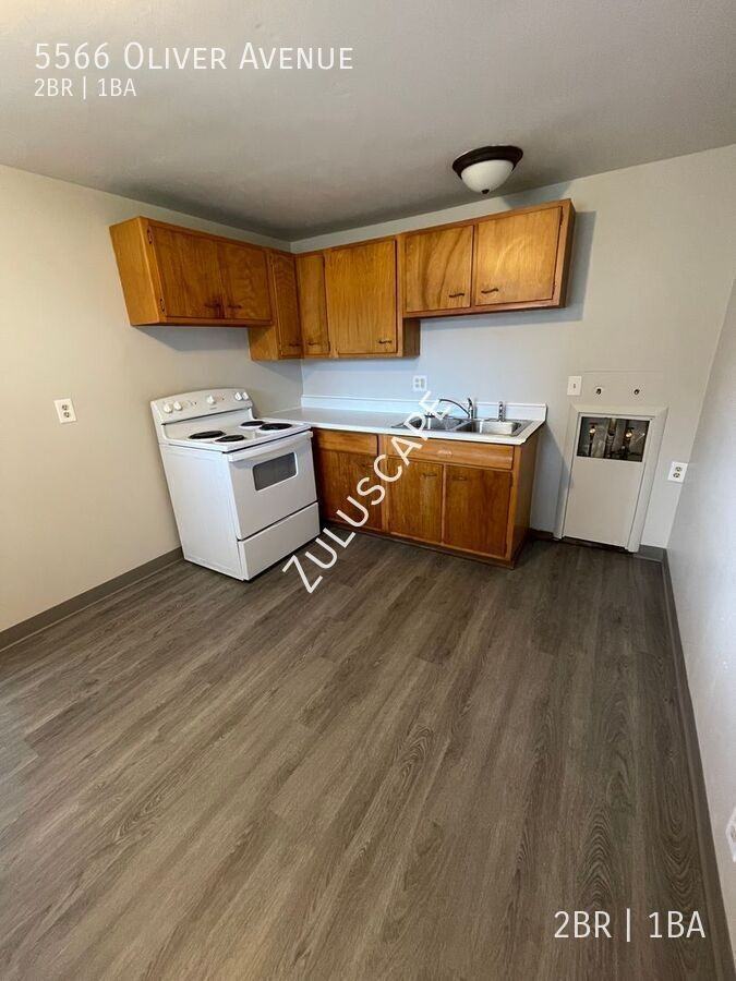 5566 Oliver Ave - Photo 4 of 7