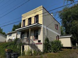 featured image of 214 E 8th St
