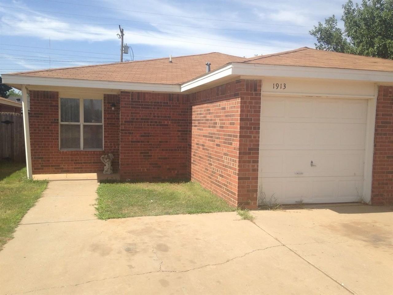 1913 S Loop 289 - Photo 2 of 10