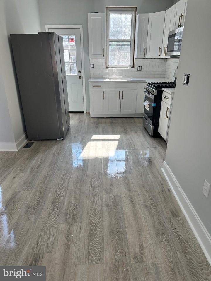 5744 Delancey St - Photo 5 of 15