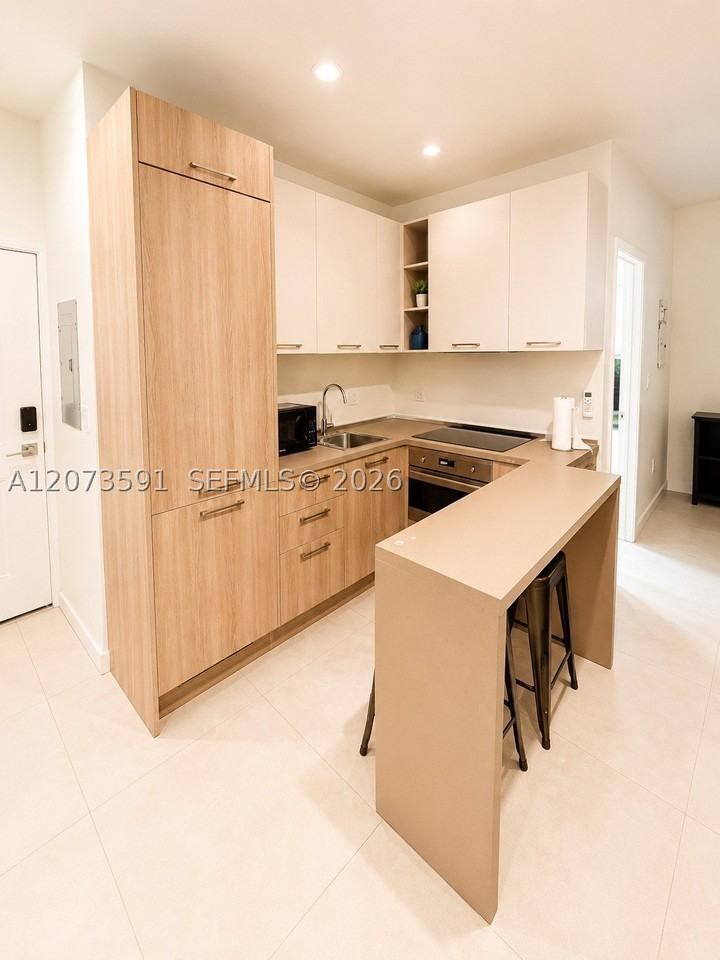 245 Ne 33rd St #107 - Photo 6 of 9