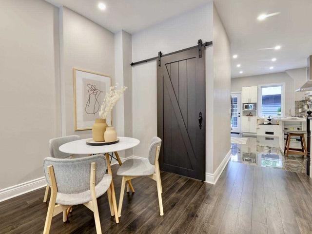 Renovated 2-Bed House-Style Rental with Private Garage & Patio | Utilities Included - Photo 5 of 19