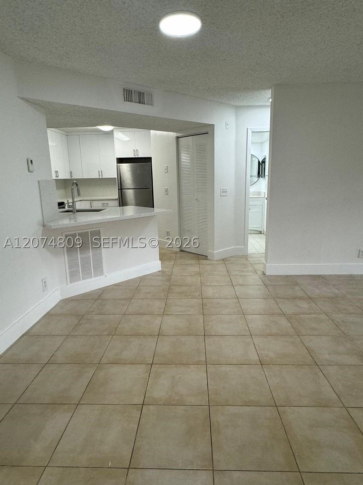 8801 Wiles Rd #103 - Photo 3 of 22