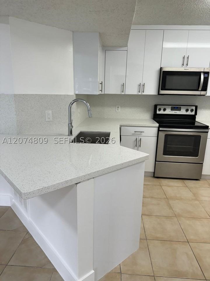 8801 Wiles Rd #103 - Photo 5 of 22