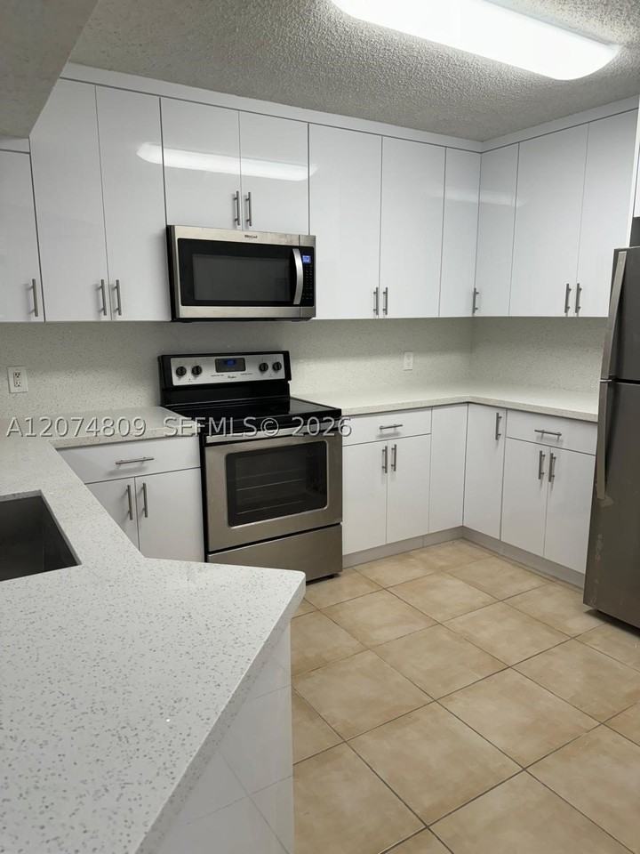 8801 Wiles Rd #103 - Photo 6 of 22