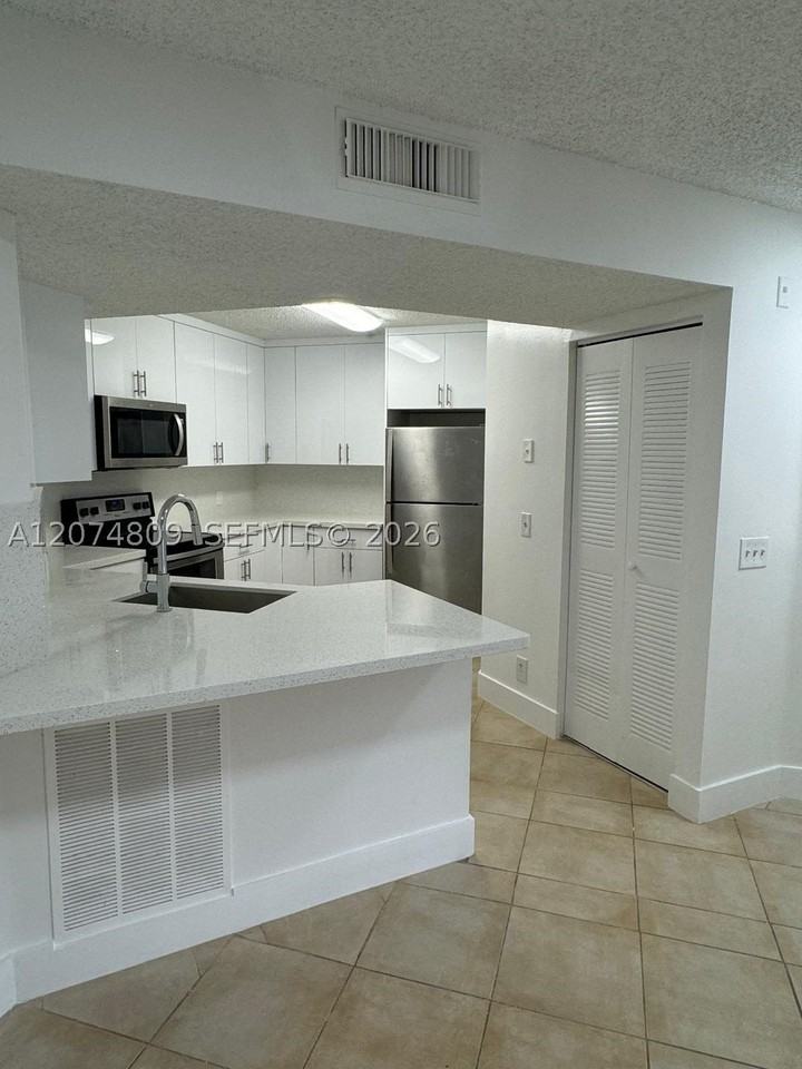 8801 Wiles Rd #103 - Photo 7 of 22
