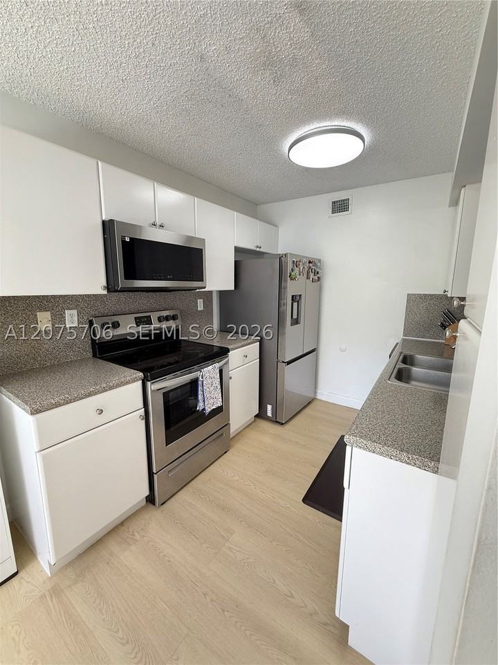 4974 Nw 97th Pl #310 - Photo 3 of 24