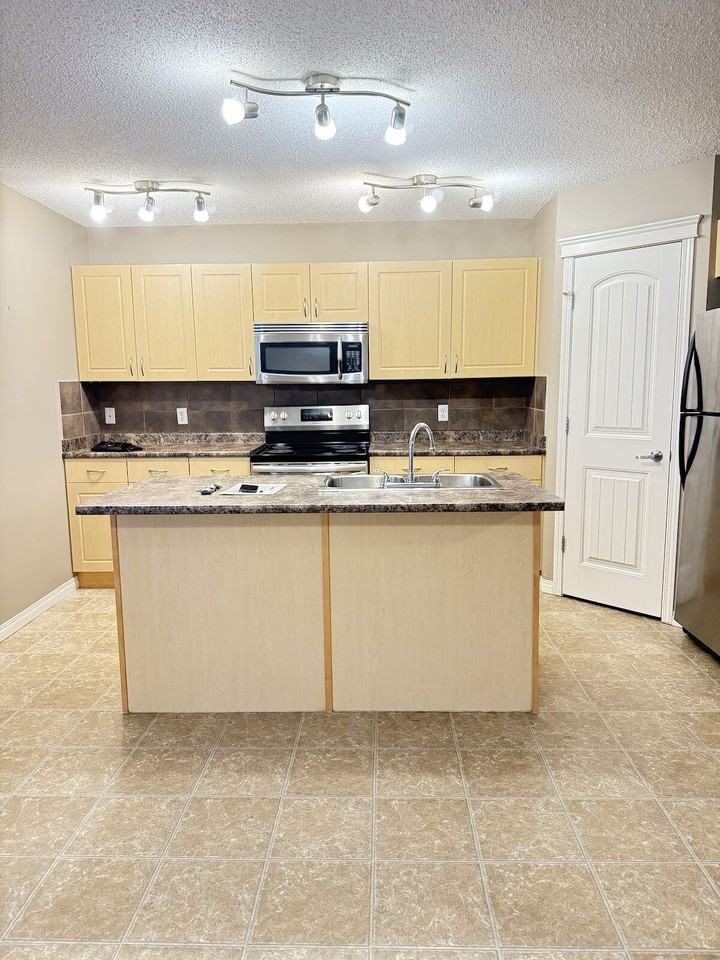 9312 Simpson Dr Nw - Photo 3 of 14