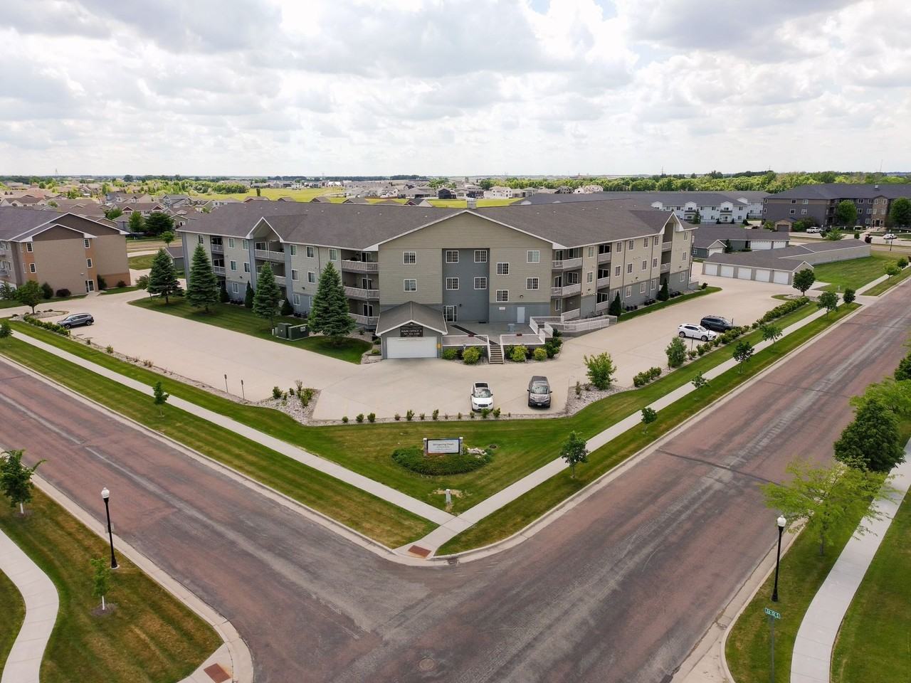 55+ Living at Whispering Creek - Photo 2 of 22