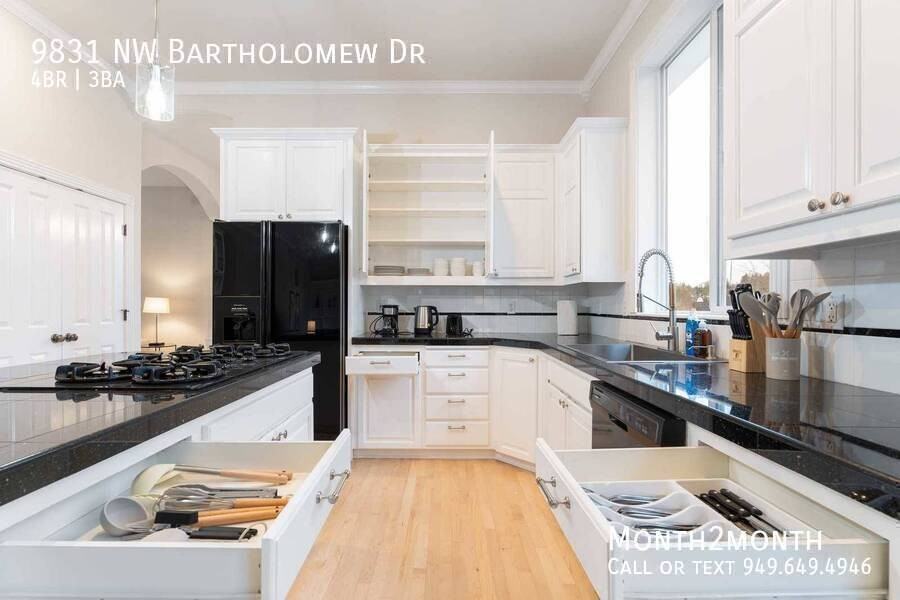 9831 Nw Bartholomew Dr - Photo 7 of 39