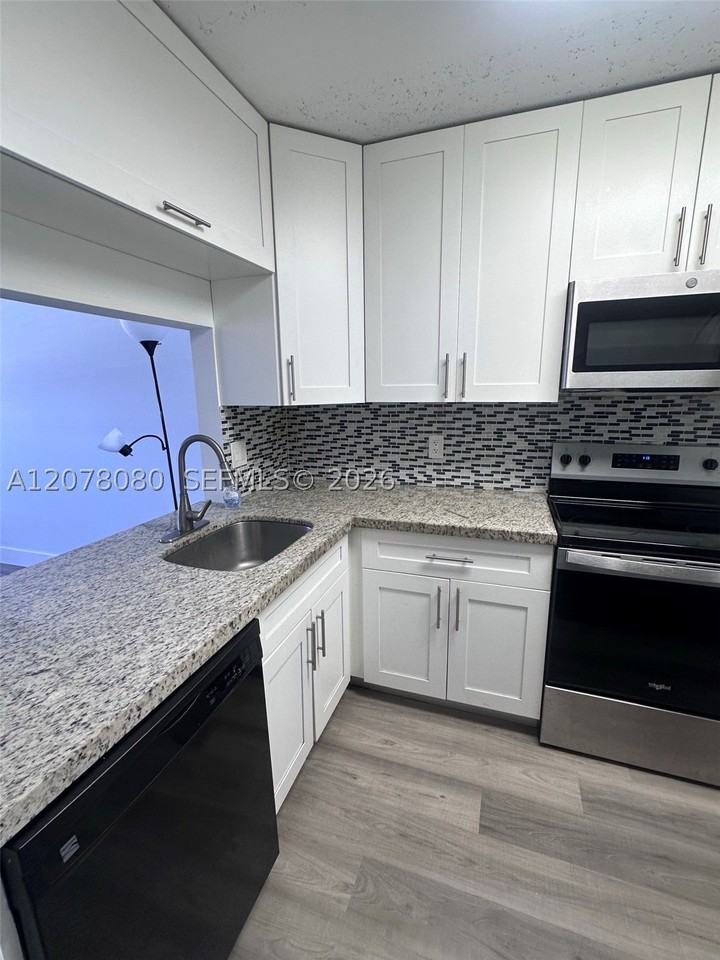 10049 Winding Lake Rd #103 - Photo 3 of 8