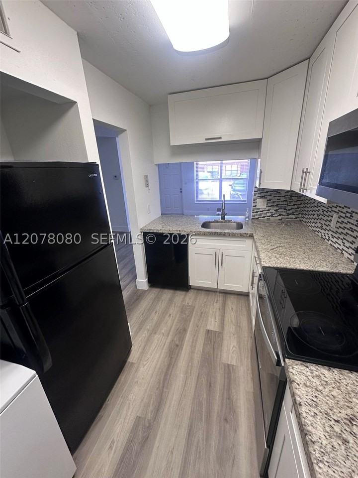10049 Winding Lake Rd #103 - Photo 4 of 8