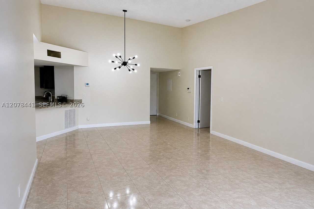 8821 Wiles Rd #304 - Photo 3 of 17