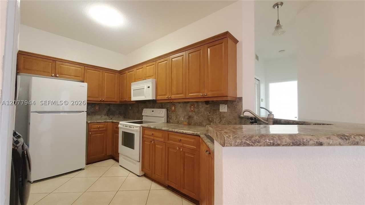 7070 Nw 177th St #205-10 - Photo 2 of 15