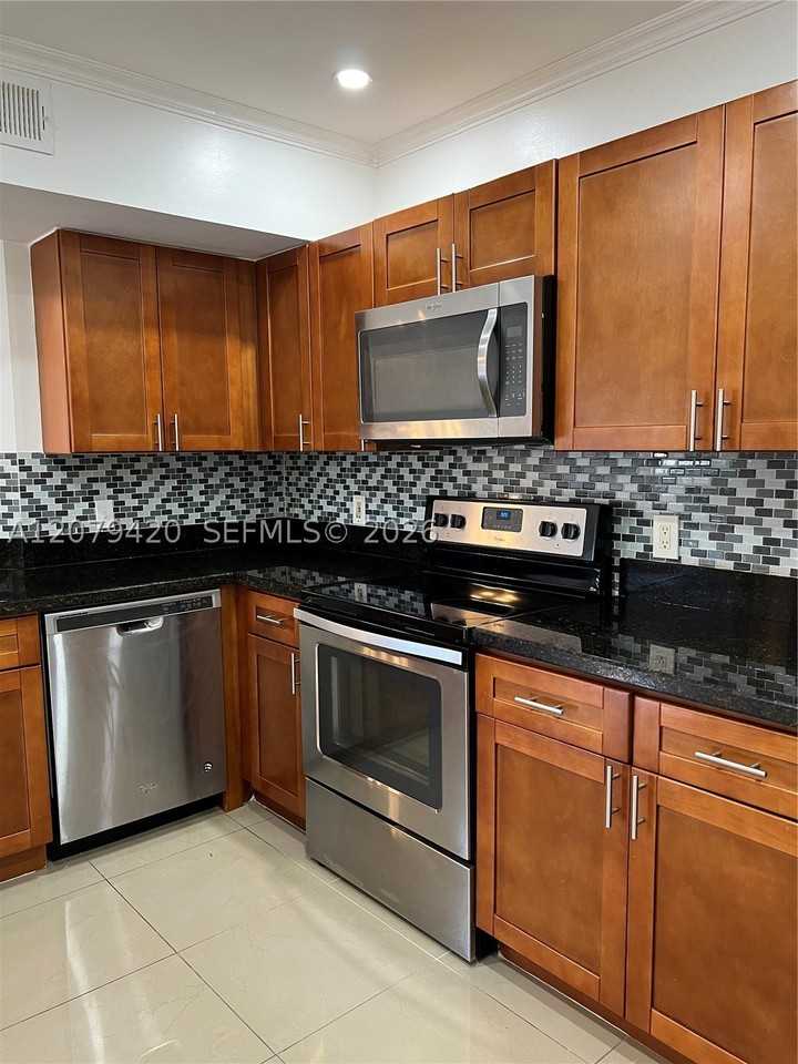 8721 Wiles Rd #306 - Photo 4 of 39
