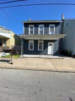 featured image of 115 W 2nd St