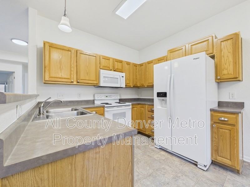 11624 W 62nd Pl #102 - Photo 6 of 25