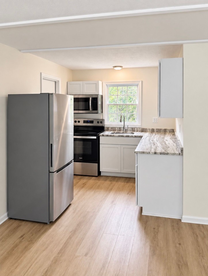 Spacious 2BR Apartments in Epsom | Garage, Basement & Large Yard - Photo 3 of 10